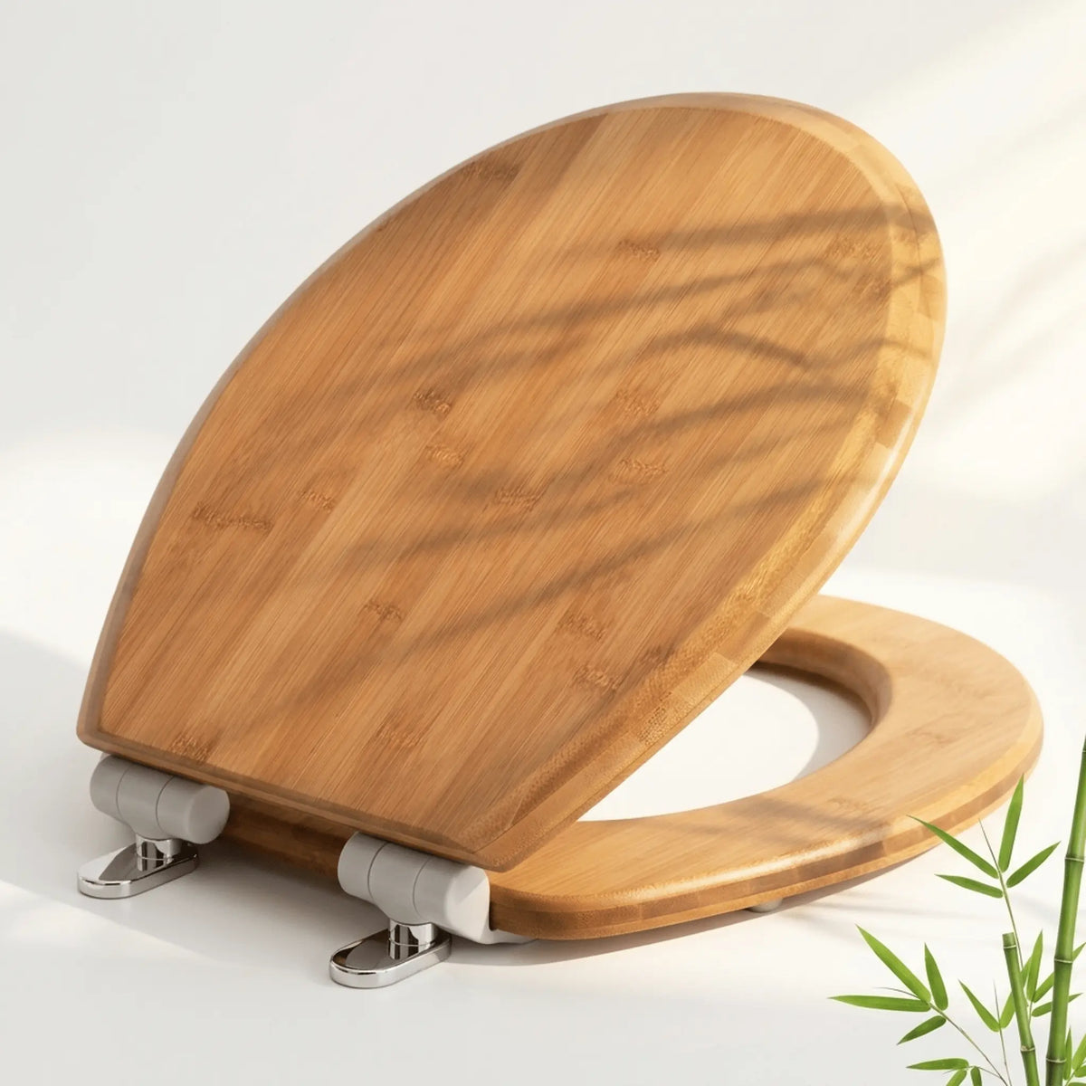 Topseat natural solid bamboo round toilet seat showcasing distinct multi-layer wood grain, styled with bamboo stalks and zen stones.