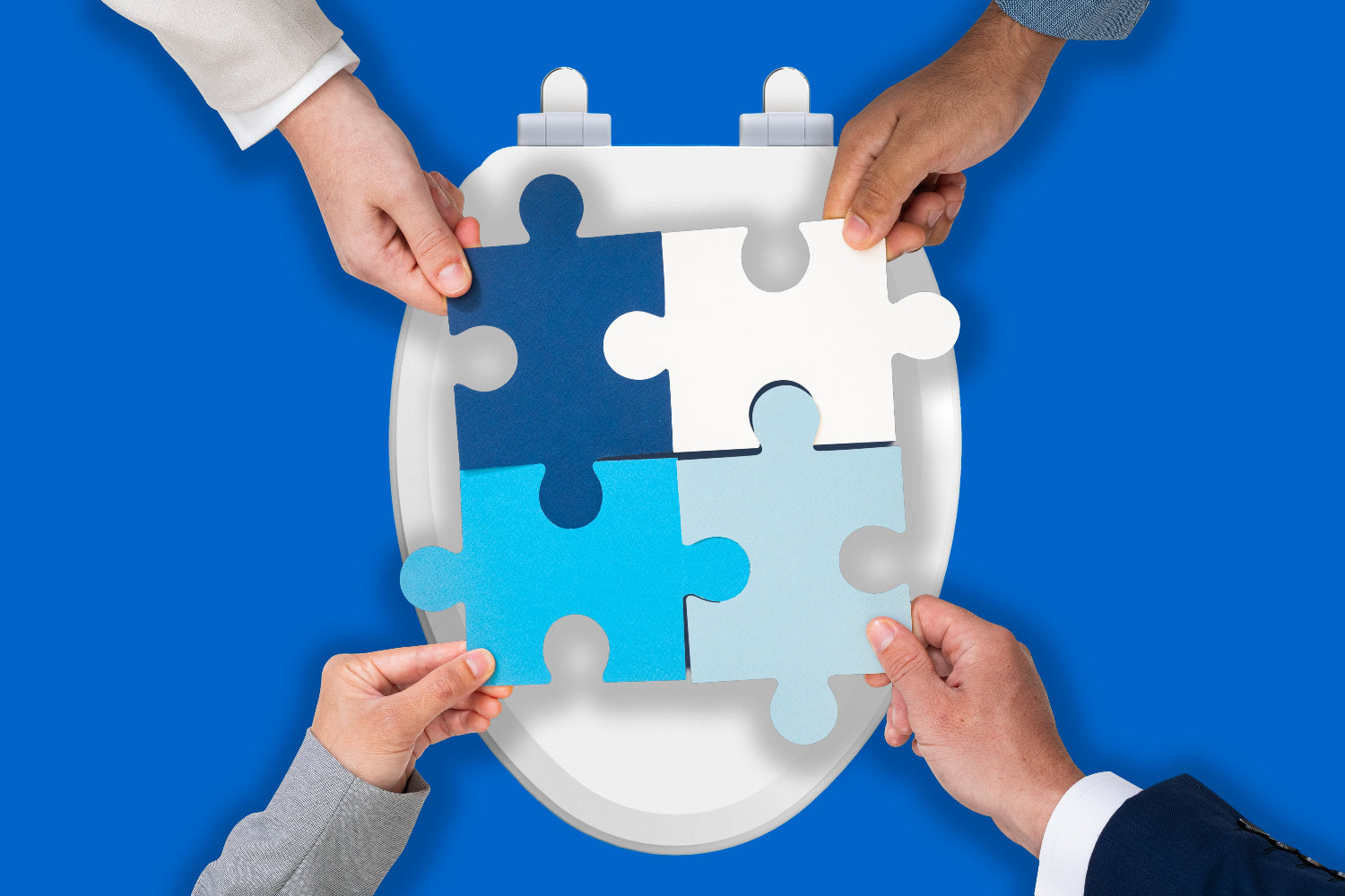 Four hands holding a puzzle piece above wood toilet seat against a blue background
