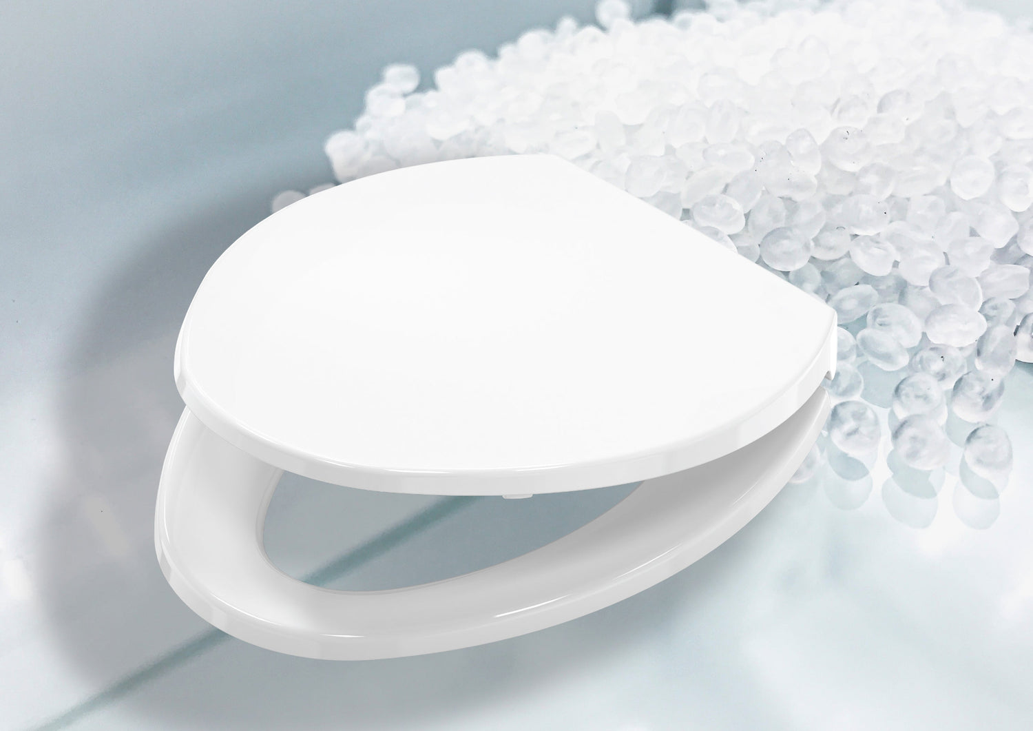 White plastic Toilet seats on a light blue background