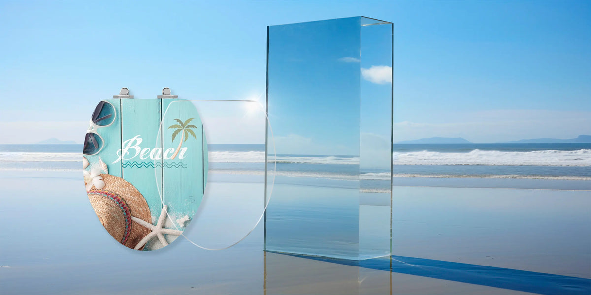 Art of Acryl Beach toilet seat lid with a clear acrylic layer shown separately to illustrate its surface construction.