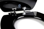 Close-up of chromed slow-close hinges on a glossy black topseat wood toilet seat with the lid raised