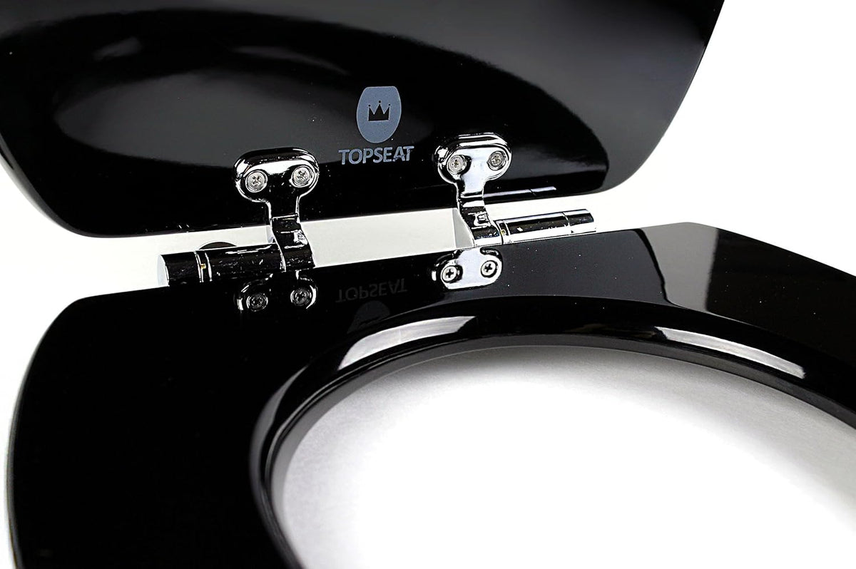 Close-up of chromed slow-close hinges on a glossy black topseat wood-composite toilet seat with the lid raised