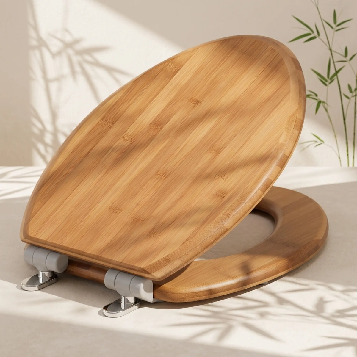 Topseat natural solid bamboo elongated toilet seat highlighting distinct multi-layer wood grain, styled with soft sunlight shadows and bamboo leaves for an organic aesthetic.