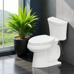 Topseat Plus plastic elongated white toilet seat installed in a modern bathroom with plants, side view.