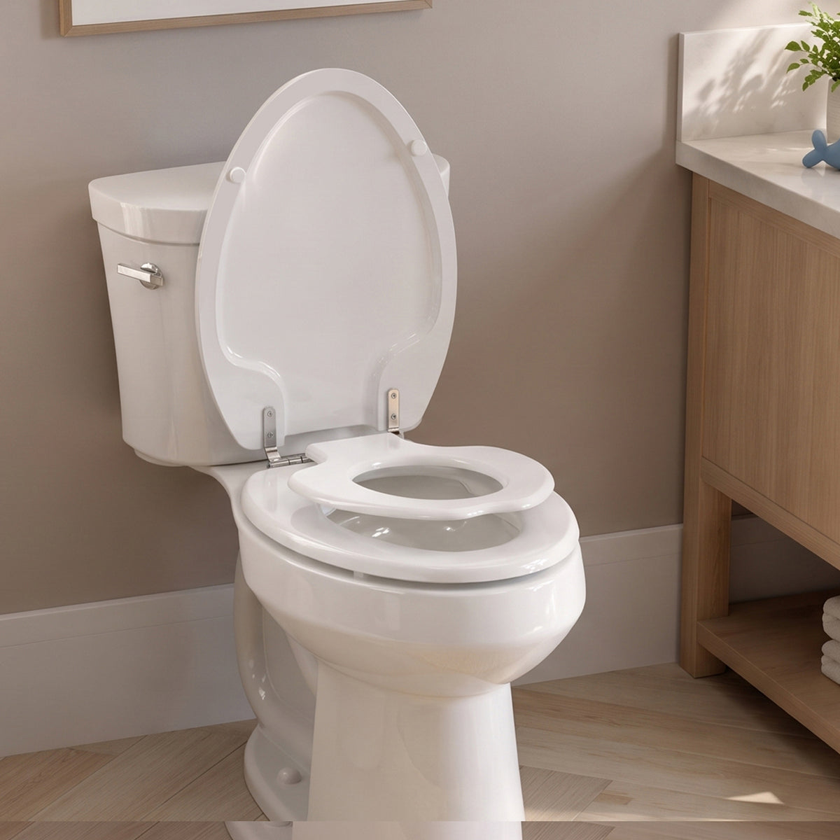 Topseat TinyHiney elongated family toilet seat with child potty-training ring raised for use in a warm modern bathroom